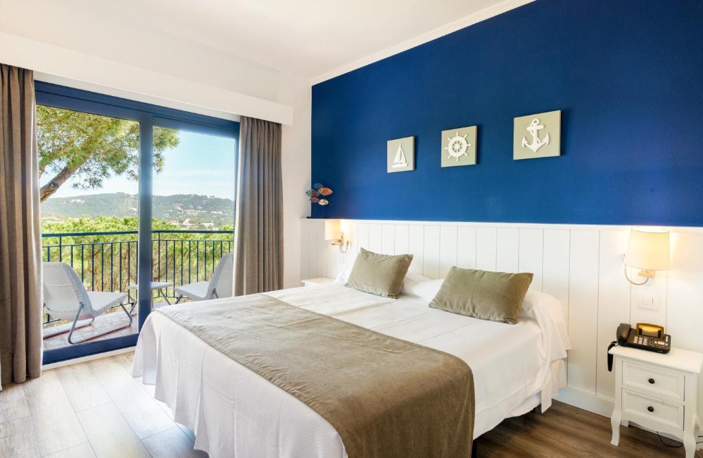 Postel nebo postele na pokoji v ubytování Hotel Garbi