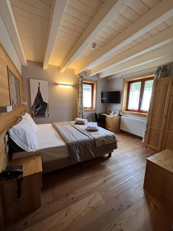 Lova arba lovos apgyvendinimo įstaigoje La Tana dell'orso Hotel & SPA