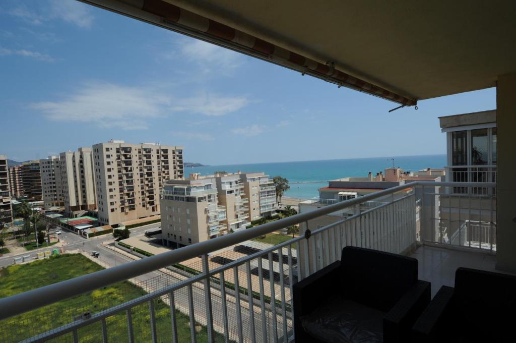 a balcony with a view of a city at PLAYASOL Orangecosta 1 dormitorio in Benicàssim