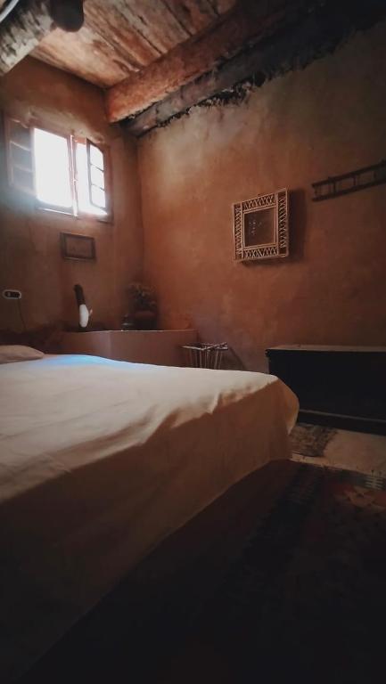 Ένα ή περισσότερα κρεβάτια σε δωμάτιο στο NaInshal Siwa