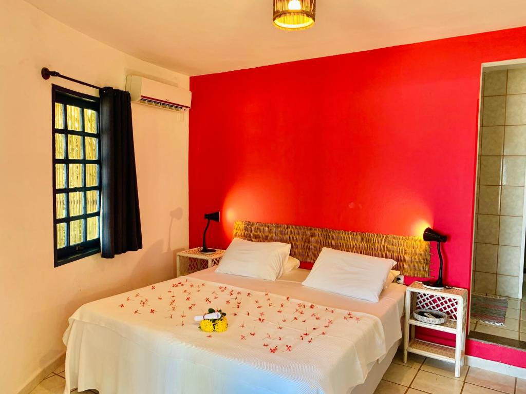 Uma cama ou camas num quarto em Pousada Maraú