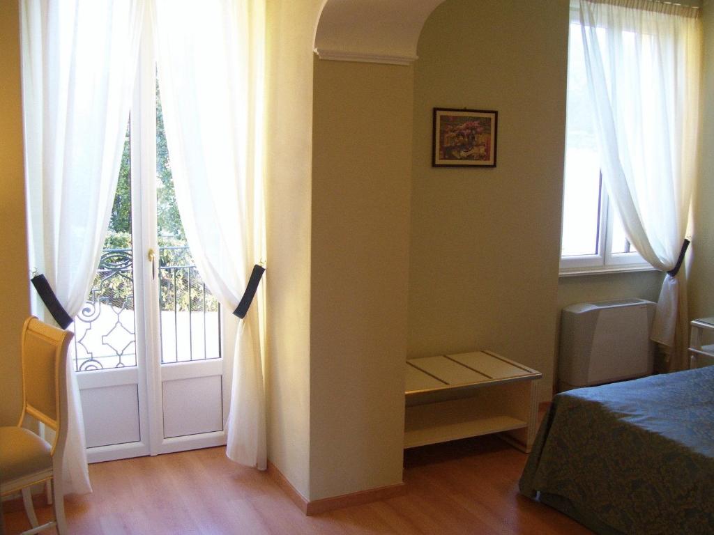 Postel nebo postele na pokoji v ubytování Villa La Mirabella