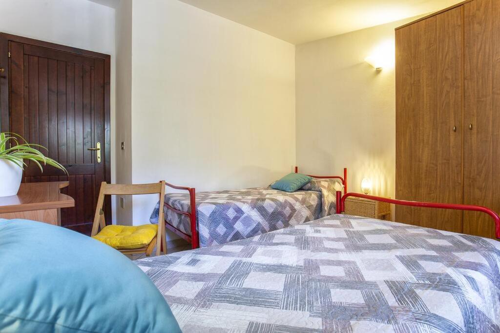 Postel nebo postele na pokoji v ubytování Il ginepro e la lantana