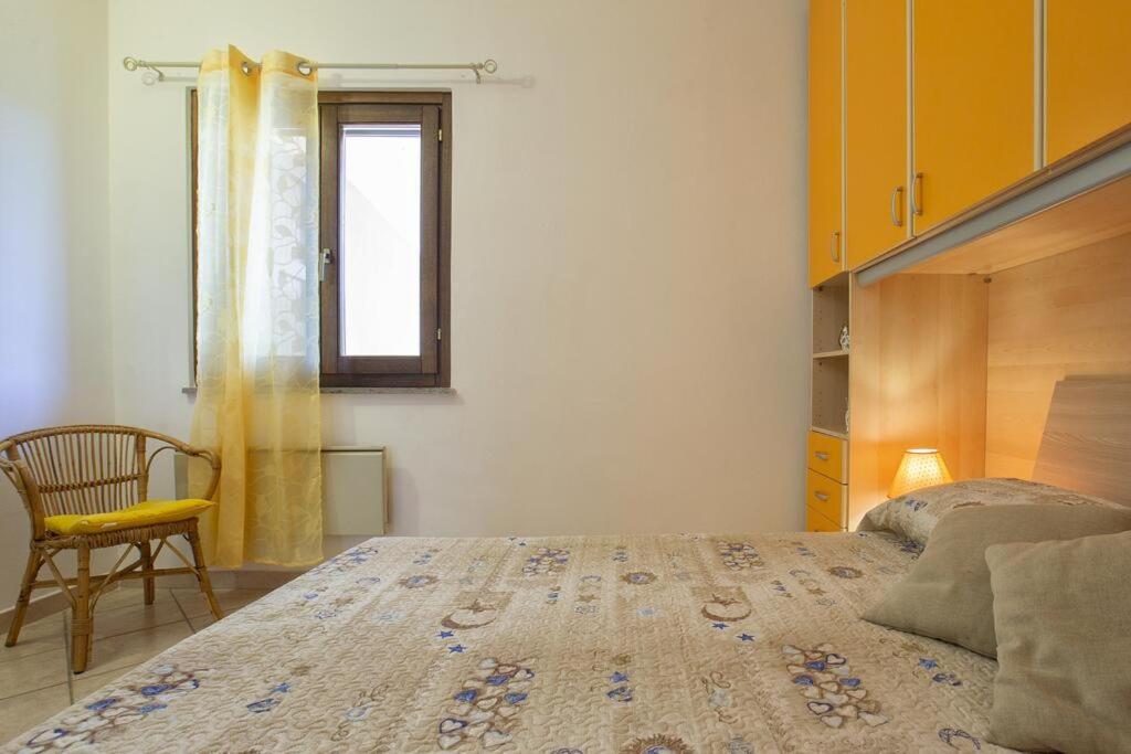 Postel nebo postele na pokoji v ubytování Il ginepro e la lantana