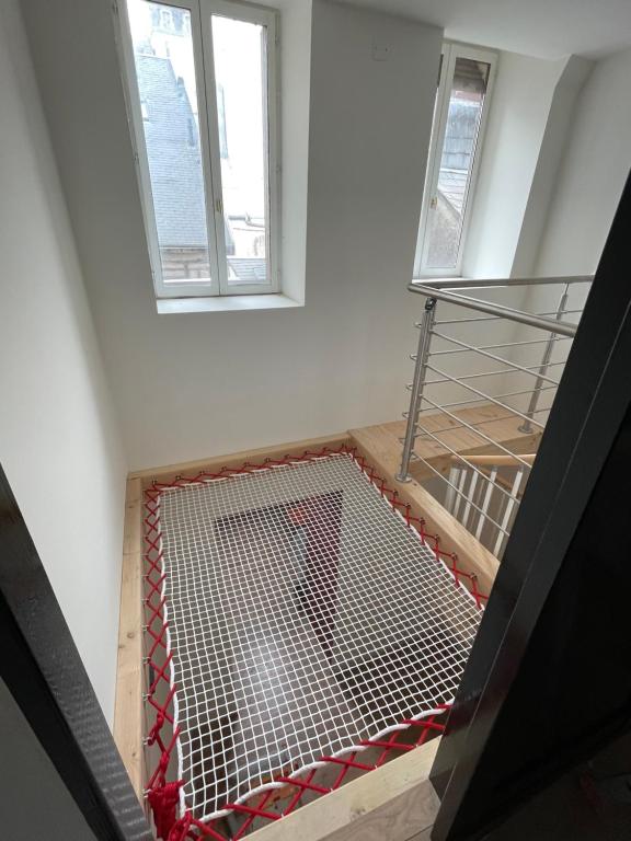 a view from the top of a building with a metal gate at Le Duplex des QUAIS in Blois