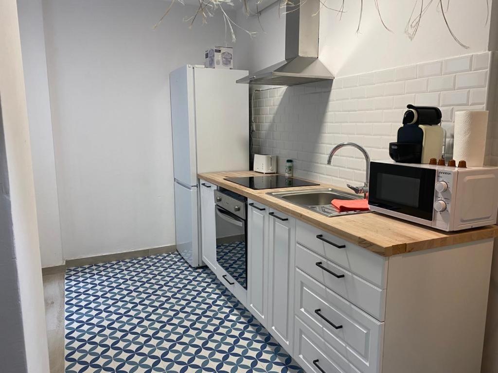 Kuchyň nebo kuchyňský kout v ubytování Alzira bonita Apartamento B con patio, la Casella