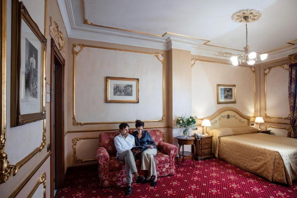 Postel nebo postele na pokoji v ubytování Grand Hotel Wagner