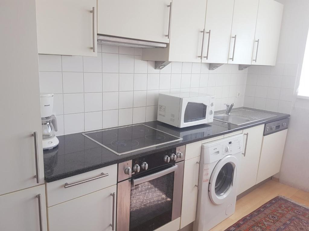 Kuchyň nebo kuchyňský kout v ubytování Hotel Haydn