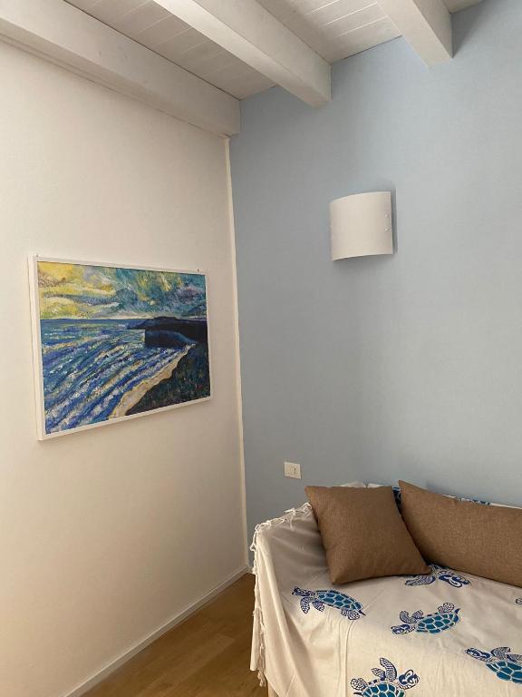 Postel nebo postele na pokoji v ubytování Le Vele Carloforte