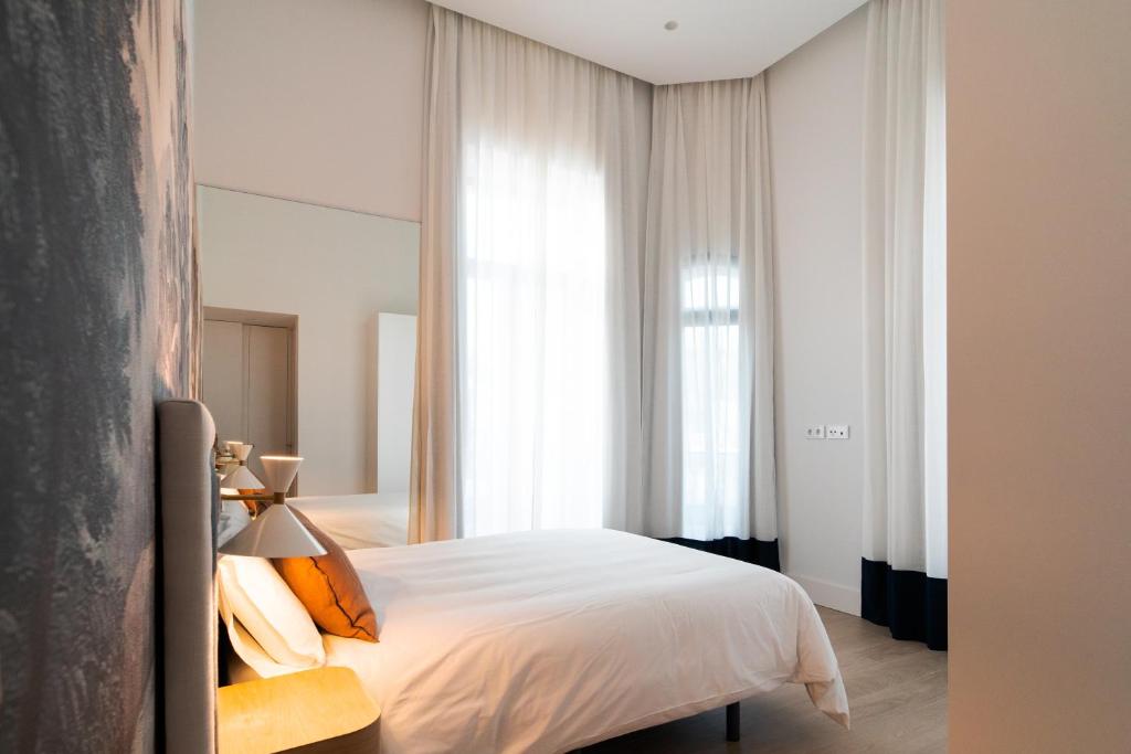 Posteľ alebo postele v izbe v ubytovaní CISNES PALACE