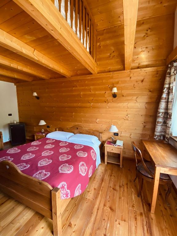 Postel nebo postele na pokoji v ubytování Hotel L'Artisin
