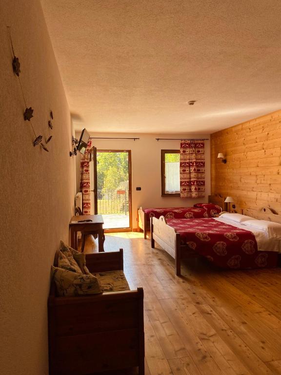 Postel nebo postele na pokoji v ubytování Hotel L'Artisin