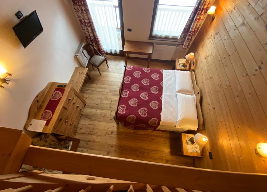 Postel nebo postele na pokoji v ubytování Hotel L'Artisin
