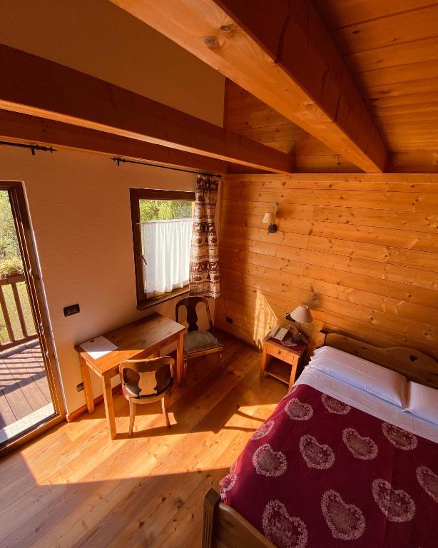 Postel nebo postele na pokoji v ubytování Hotel L'Artisin