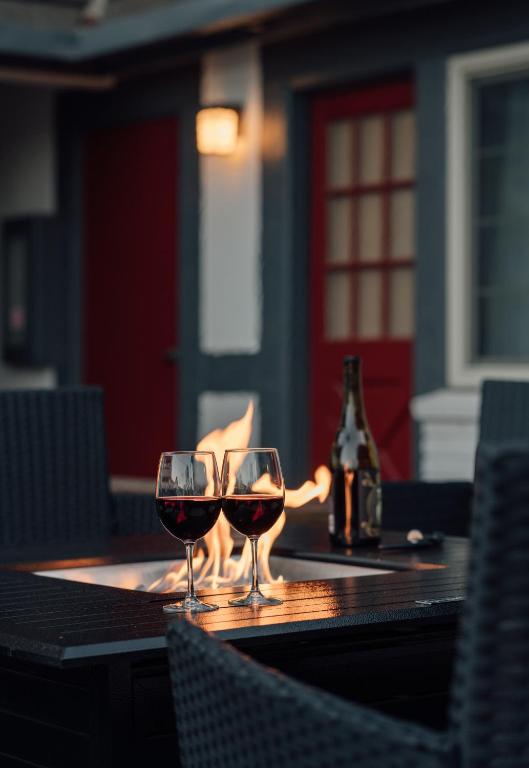 two glasses of red wine sitting on a table at New Haven Inn in Solvang