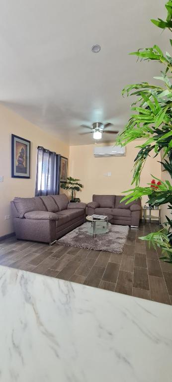 a living room with two couches and a table at super condo with fiber optic internet in Puerto Peñasco