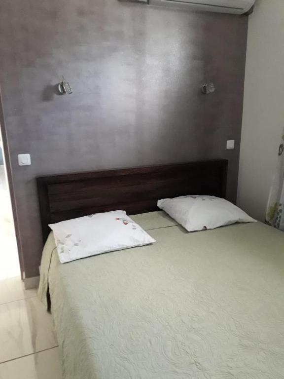 Postel nebo postele na pokoji v ubytování JONA APT