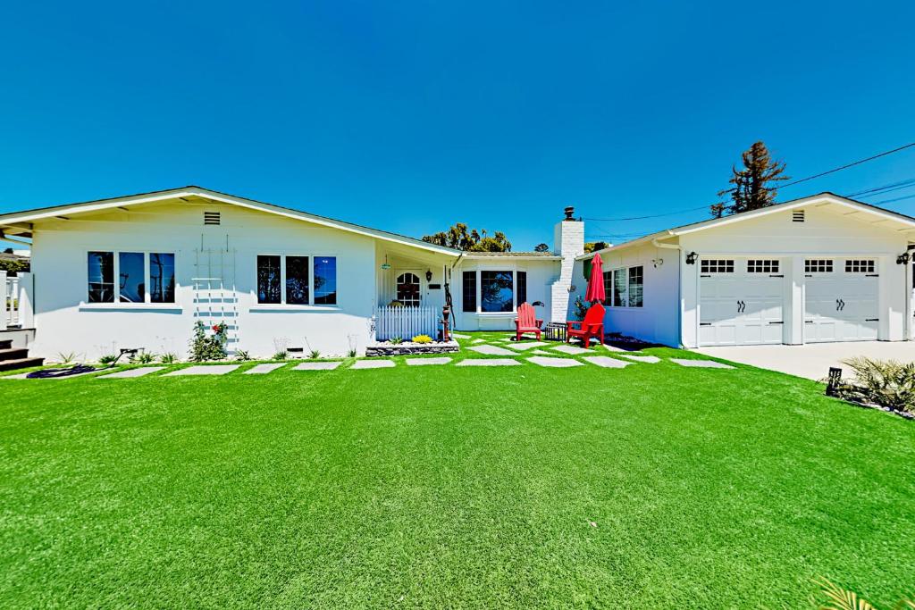 a white house with a lawn in front of it at Netport Oasis in Arroyo Grande