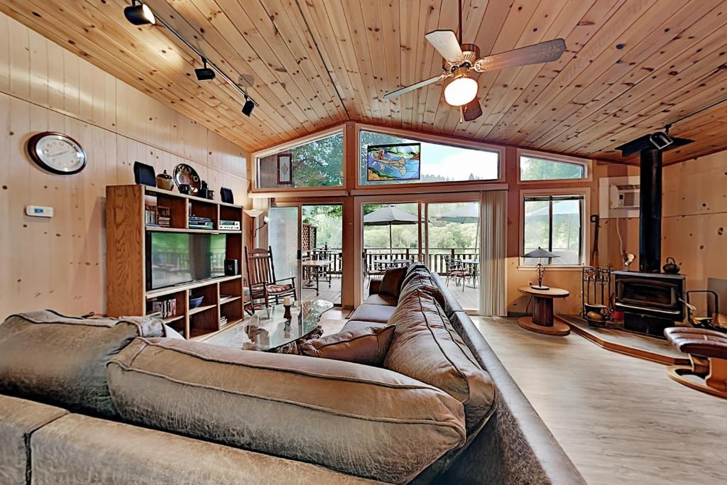 a large living room with a couch and a ceiling fan at Villa Eileen in Guerneville