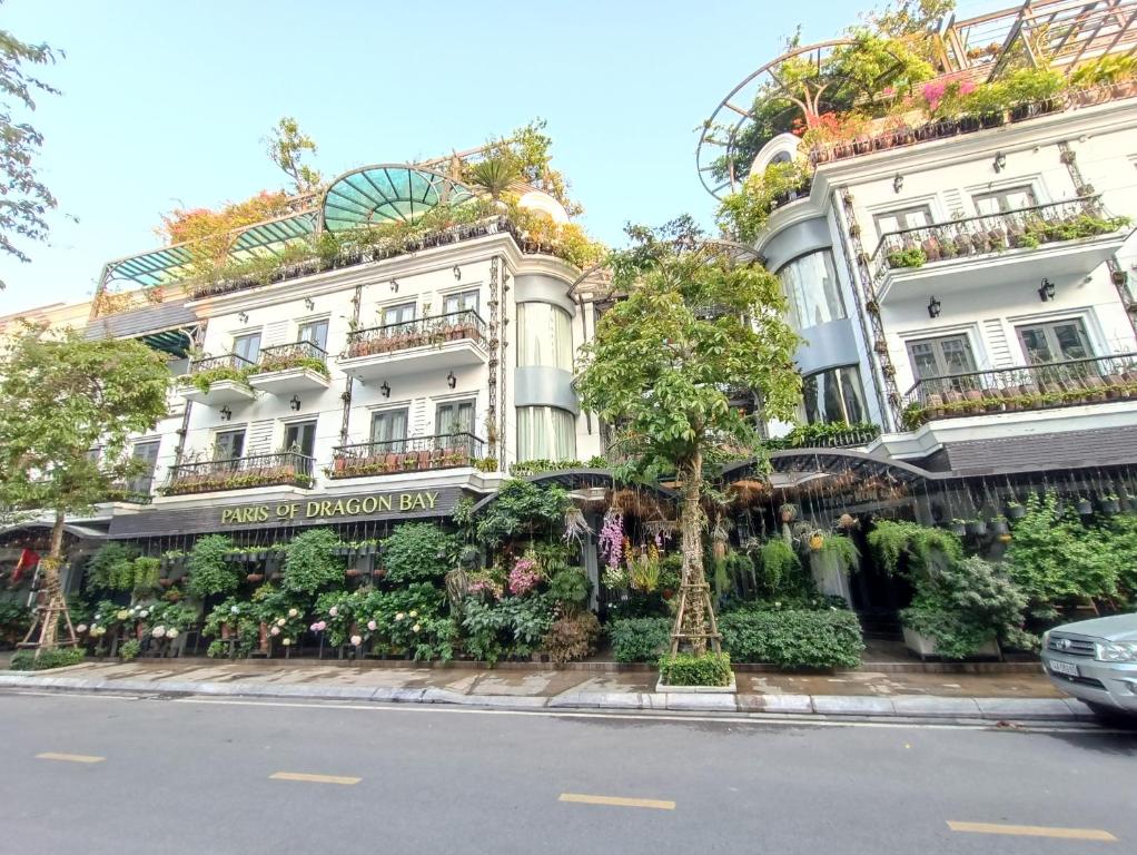 a large white building with a lot of plants at Paris Of Dragon Bay in Ha Long