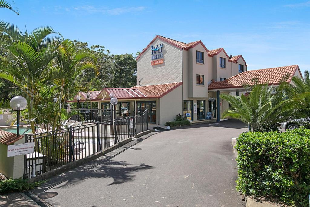 a hotel with a gate in front of a building at Nelson Bay Breeze in Nelson Bay