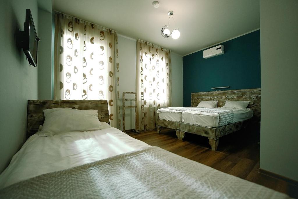 Postel nebo postele na pokoji v ubytování Hotel Kutaisi Globus