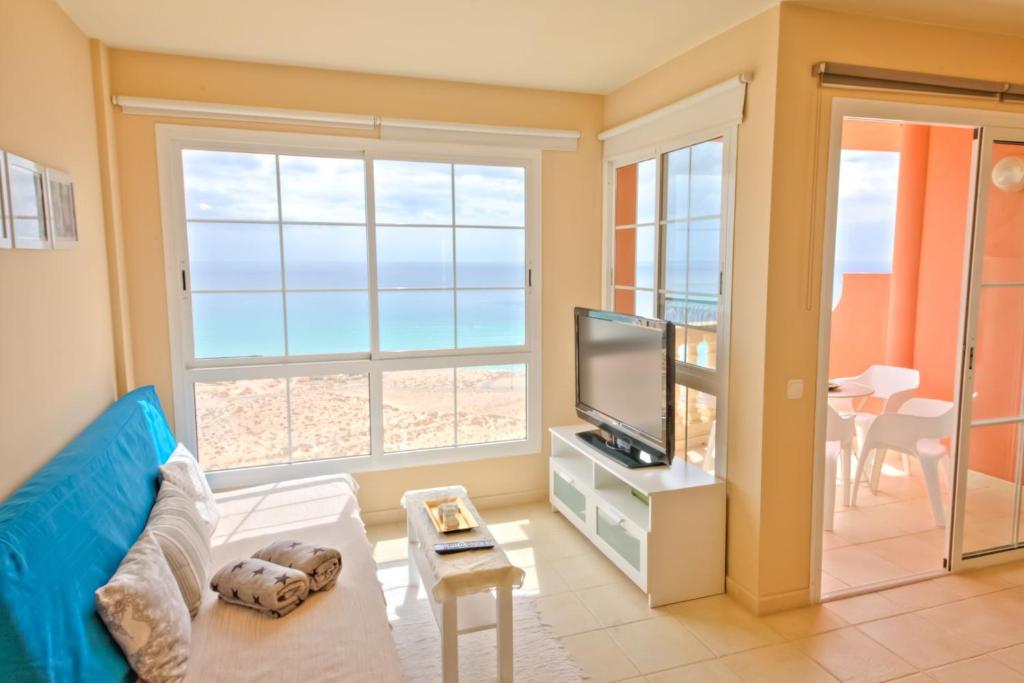 TV a/nebo společenská místnost v ubytování Playa Paraiso