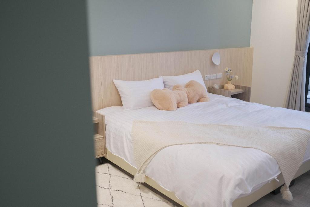 Postel nebo postele na pokoji v ubytování Zhou Ping