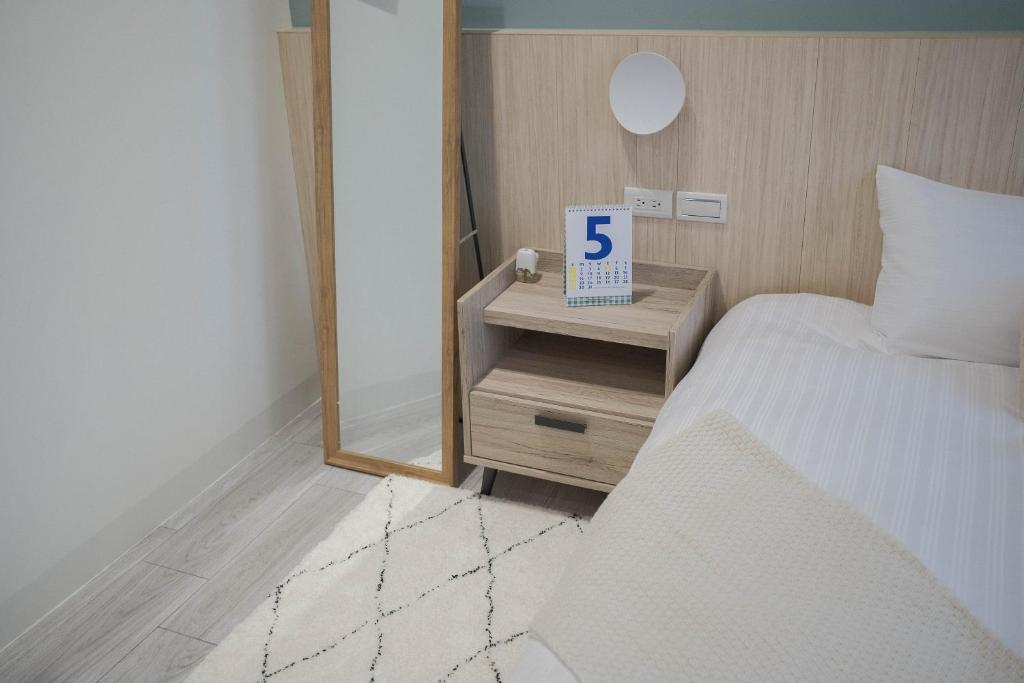 Postel nebo postele na pokoji v ubytování Zhou Ping