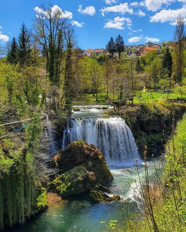 a waterfall in the middle of a river at D.I.M. Holiday House in Seliste Dreznicko