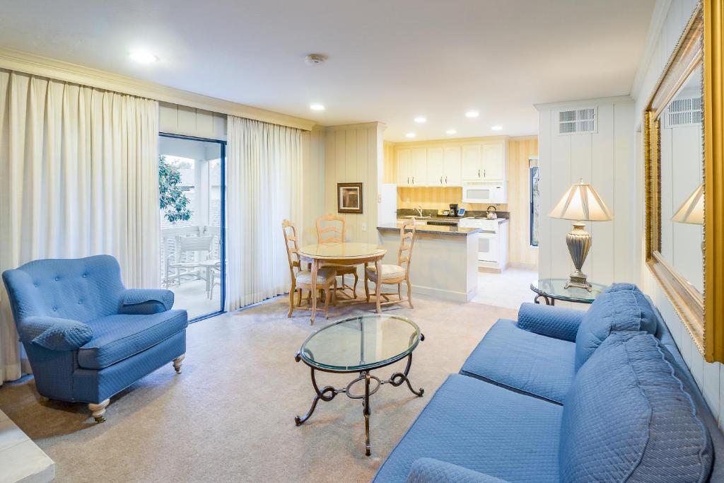 a living room with a blue couch and a table at Silverado Resort and Spa 221 in Napa