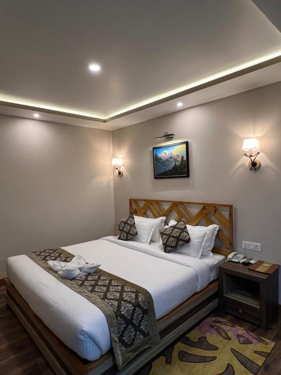 Postel nebo postele na pokoji v ubytování Hotel Kesu Home
