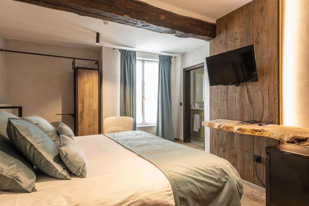 Postel nebo postele na pokoji v ubytování Hotel LEA - Maison Caerdinael
