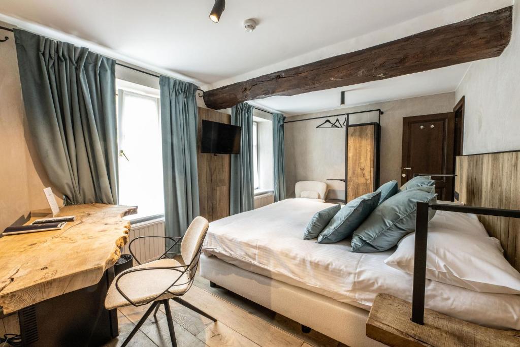 Postel nebo postele na pokoji v ubytování Hotel LEA - Maison Caerdinael