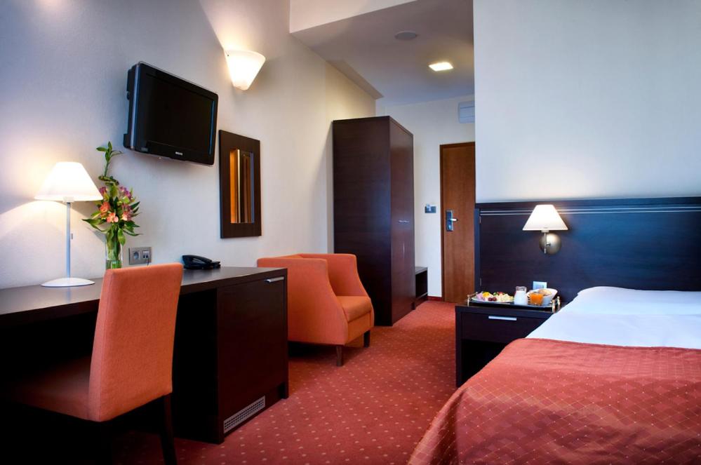 Postel nebo postele na pokoji v ubytování Hotel Tatra
