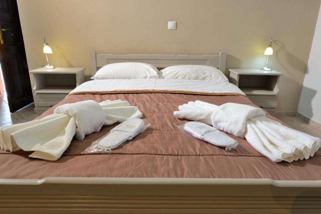 Postel nebo postele na pokoji v ubytování Artemis Apartments