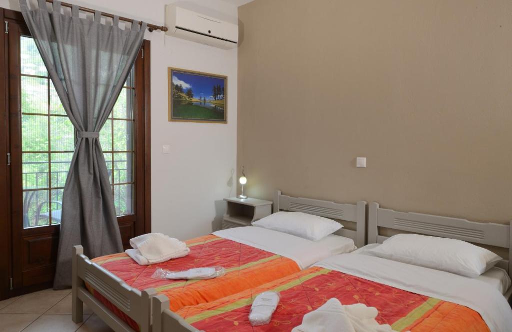 Postel nebo postele na pokoji v ubytování Artemis Apartments