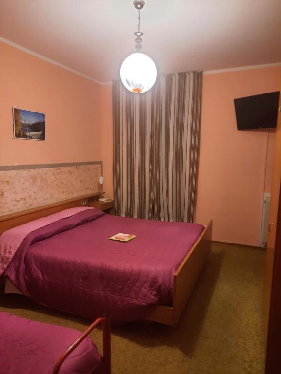 Postel nebo postele na pokoji v ubytování Albergo la Valle