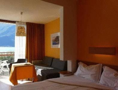 Postel nebo postele na pokoji v ubytování Hotel Lido
