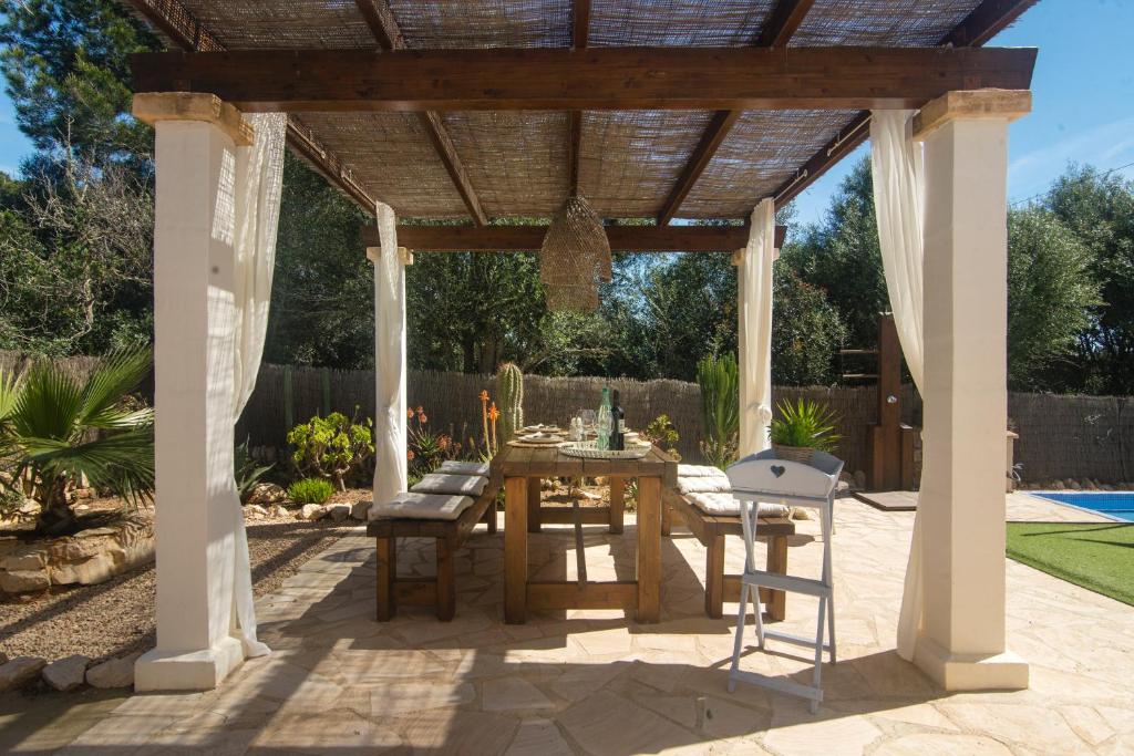 A patio or other outdoor area at Casa Azul Stylish beach house for 4 adults and 1 child in Cala Llombards