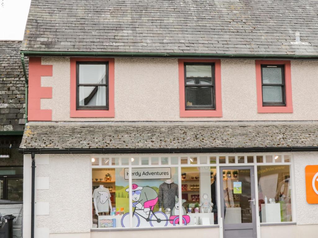 a store front with a pink and white building at The Getaway in Keswick