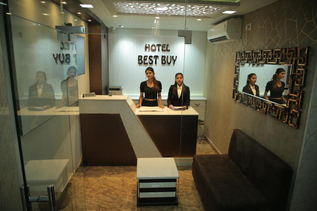 a group of women sitting at a desk in a room at Hotel Best Buy in Kolkata
