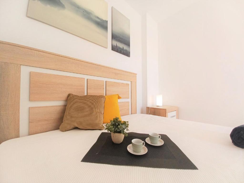 
A bed or beds in a room at Acrópole Beach Apartment
