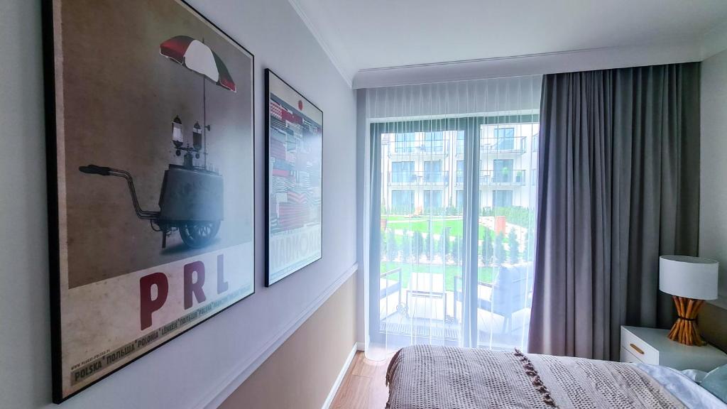 Posteľ alebo postele v izbe v ubytovaní NA WYDMIE APARTAMENT - Rezydencja Niechorze 111
