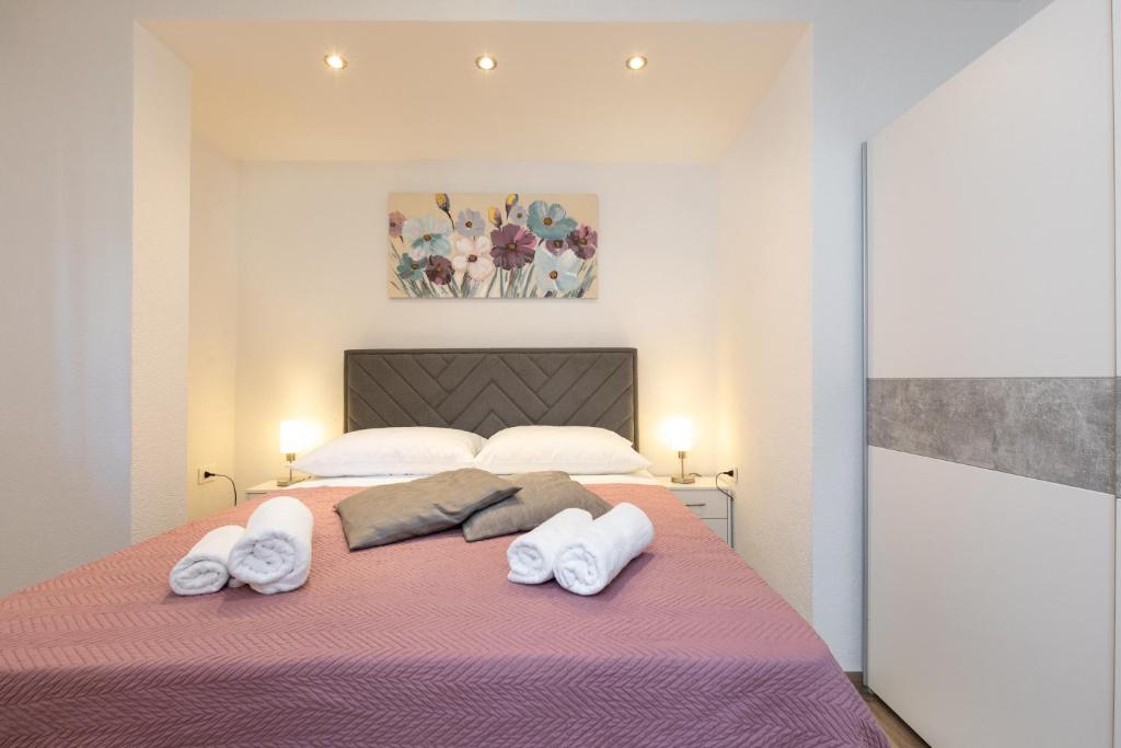 Łóżko lub łóżka w pokoju w obiekcie Apartman Ruza