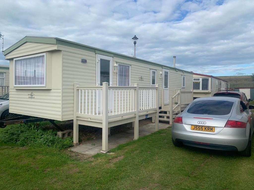 a house with a car parked in front of it at 187 sealands in Ingoldmells