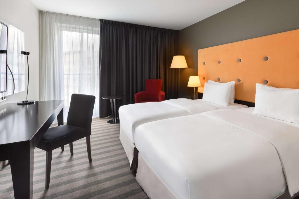 Postel nebo postele na pokoji v ubytování Radisson Blu Sobieski