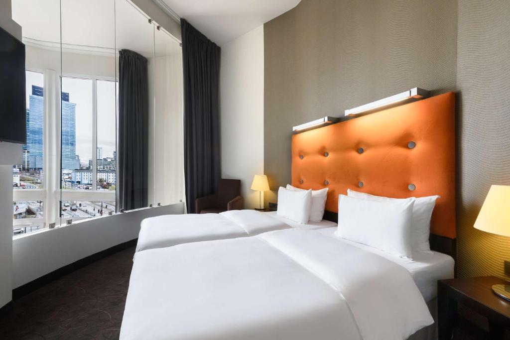 Postel nebo postele na pokoji v ubytování Radisson Blu Sobieski