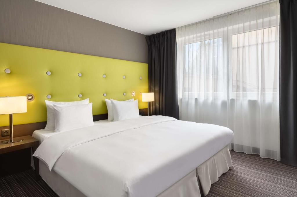 Postel nebo postele na pokoji v ubytování Radisson Blu Sobieski