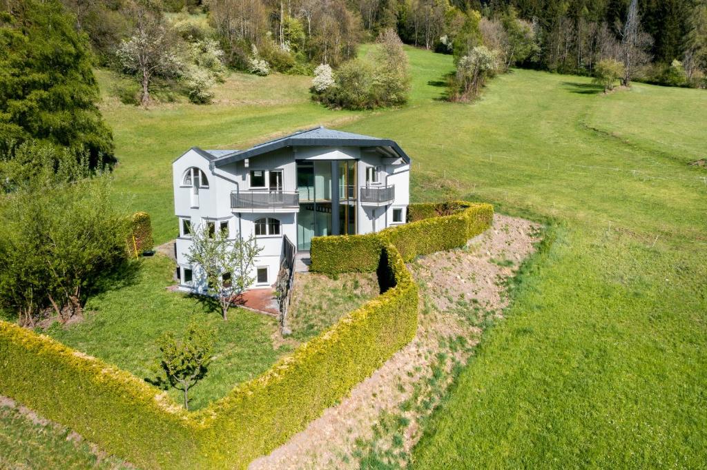 an aerial view of a house in a field at Armelen Villa in Oetz